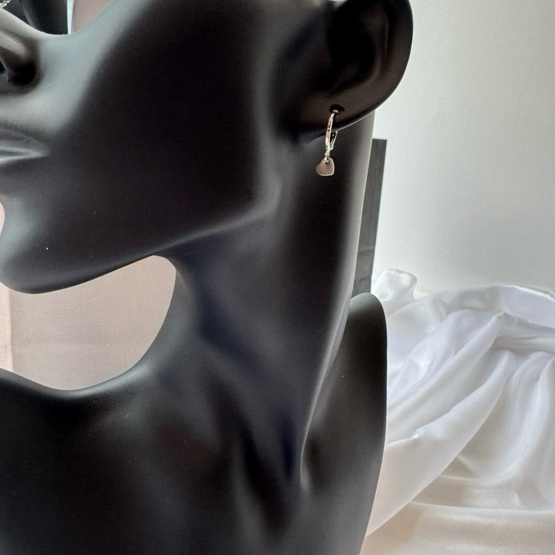 Silver heart huggie earrings